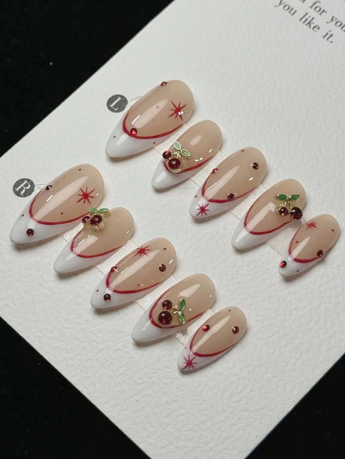 10 pieces of pure handmade almond-shaped nails, with white French tips and red cherry decorations.