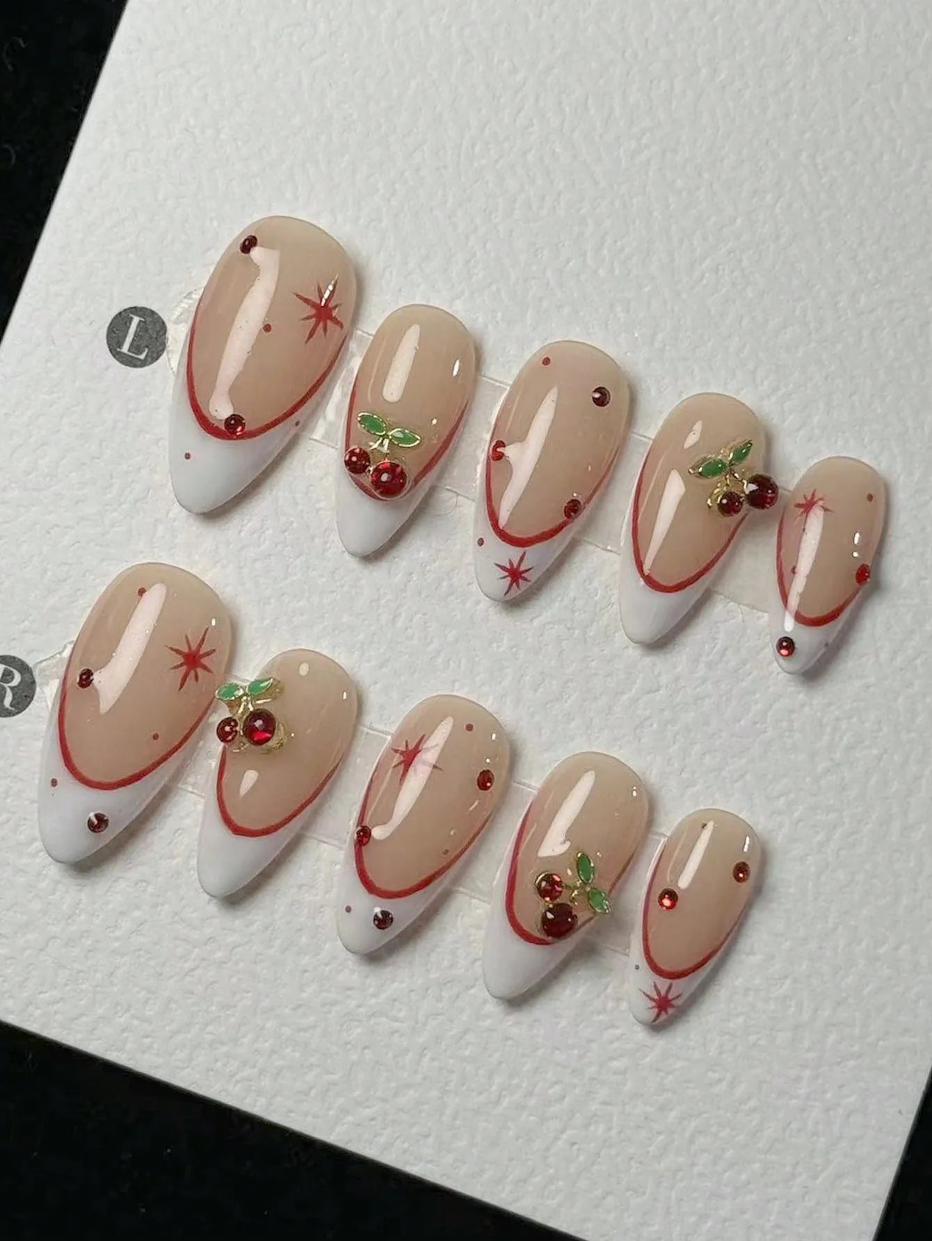 10 pieces of pure handmade almond-shaped nails, with white French tips and red cherry decorations.